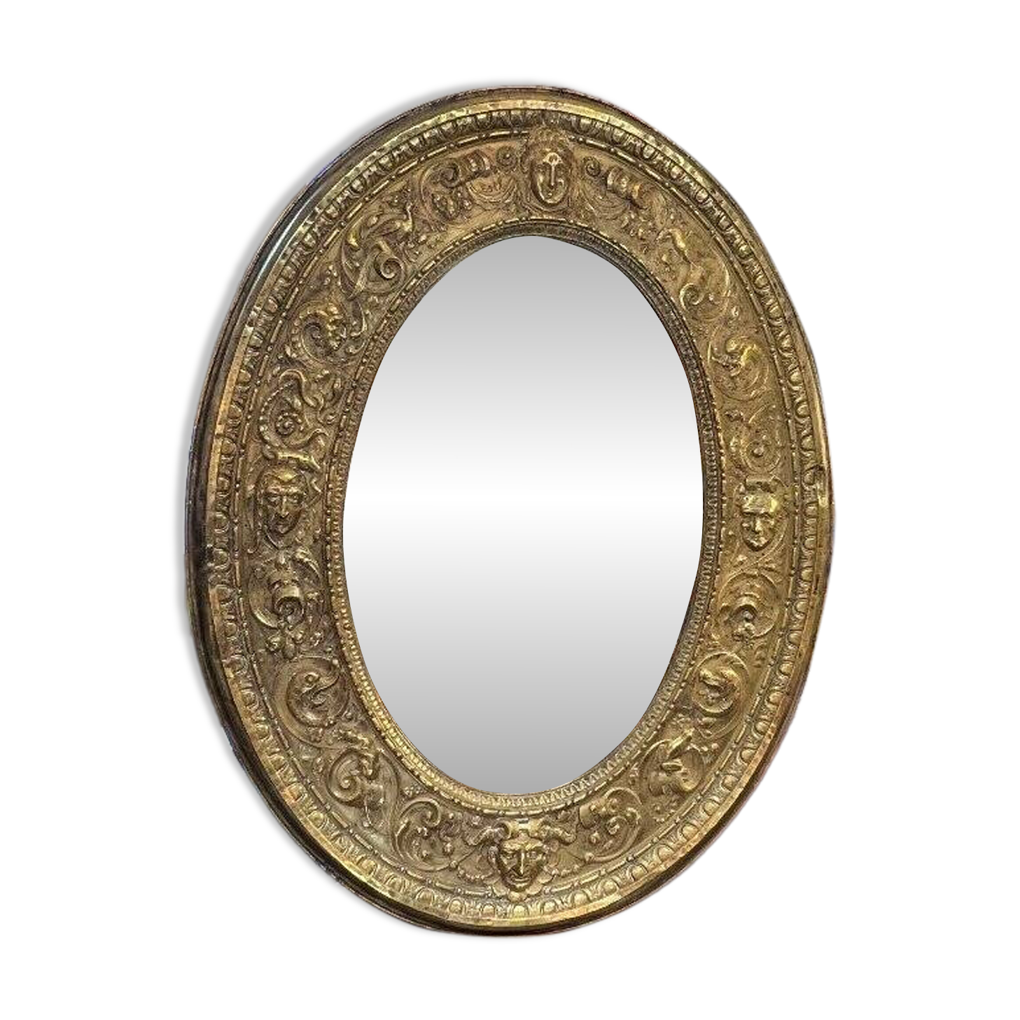 A. Arens, Antwerp, important oval mirror in repoussé brass with numerous animal decorations
