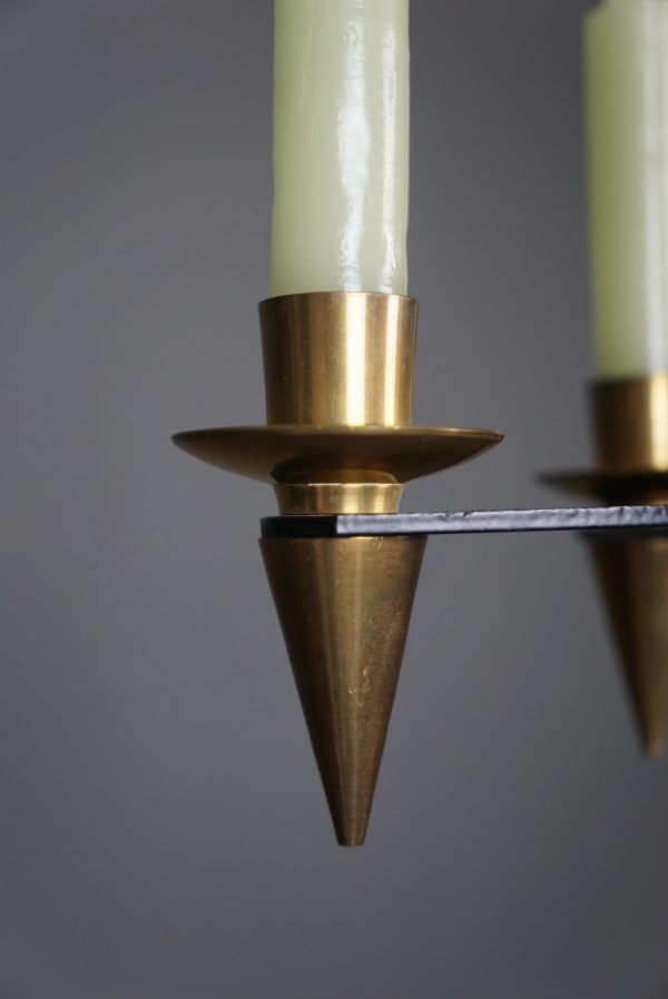 Candle holder in black metal and brass