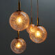 Four gold fleck globe pendants by Doria Germany
