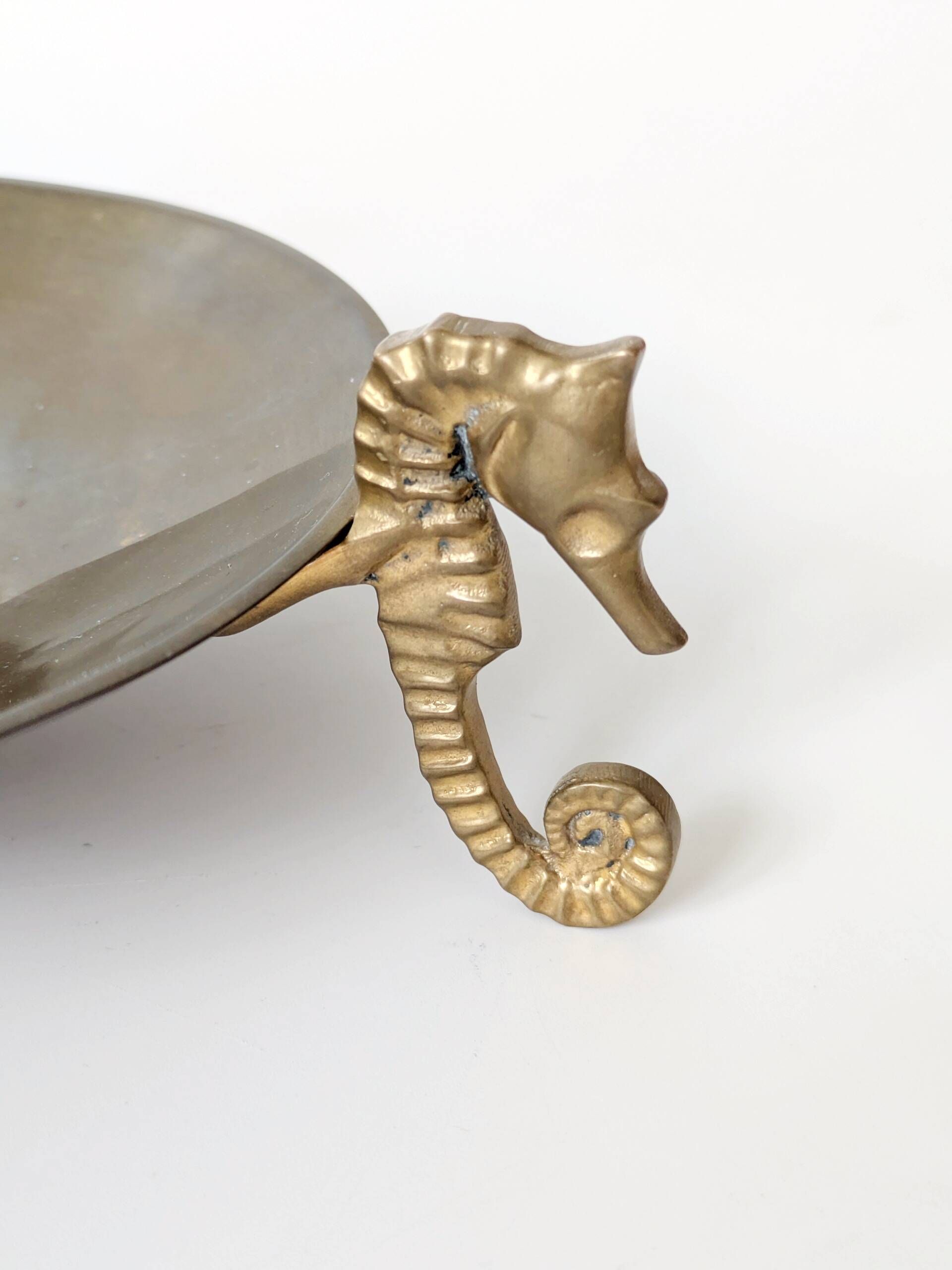 Vintage round brass tray on seahorse feet