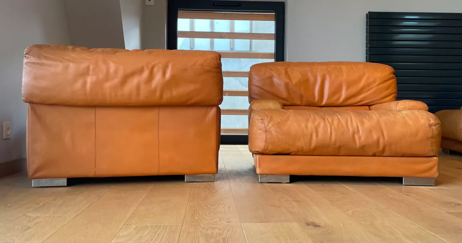 Pair of vintage armchairs Gérard Guermonprez tawny leather and stainless steel, France 1970