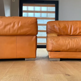 Pair of vintage armchairs Gérard Guermonprez tawny leather and stainless steel, France 1970