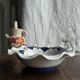 Small hand-painted earthenware salad bowl with garland of blue flowers, mark below