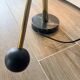 Eichholtz Cordero desk lamp in brass, black metal and marble.