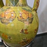 Large decorative vase with handles – painted floral design – on a metal stand