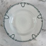 Set of 7 deep plates in earthenware, decorated with a green frieze.