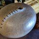 Vintage sandstone vase, in the shape of a rugby ball, signed