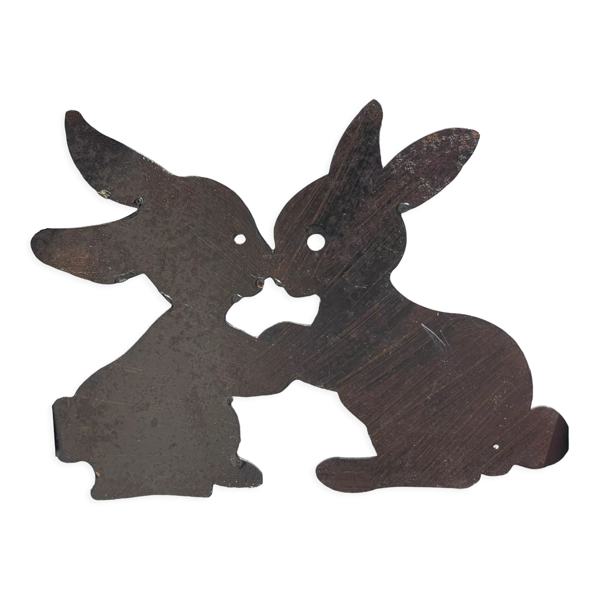 Cast iron plate in the shape of rabbits