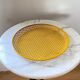 Mathieu Matégot round perforated metal tray, yellow, France 1950s