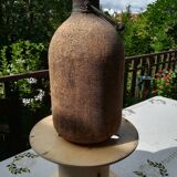 Old bottle covered with liege