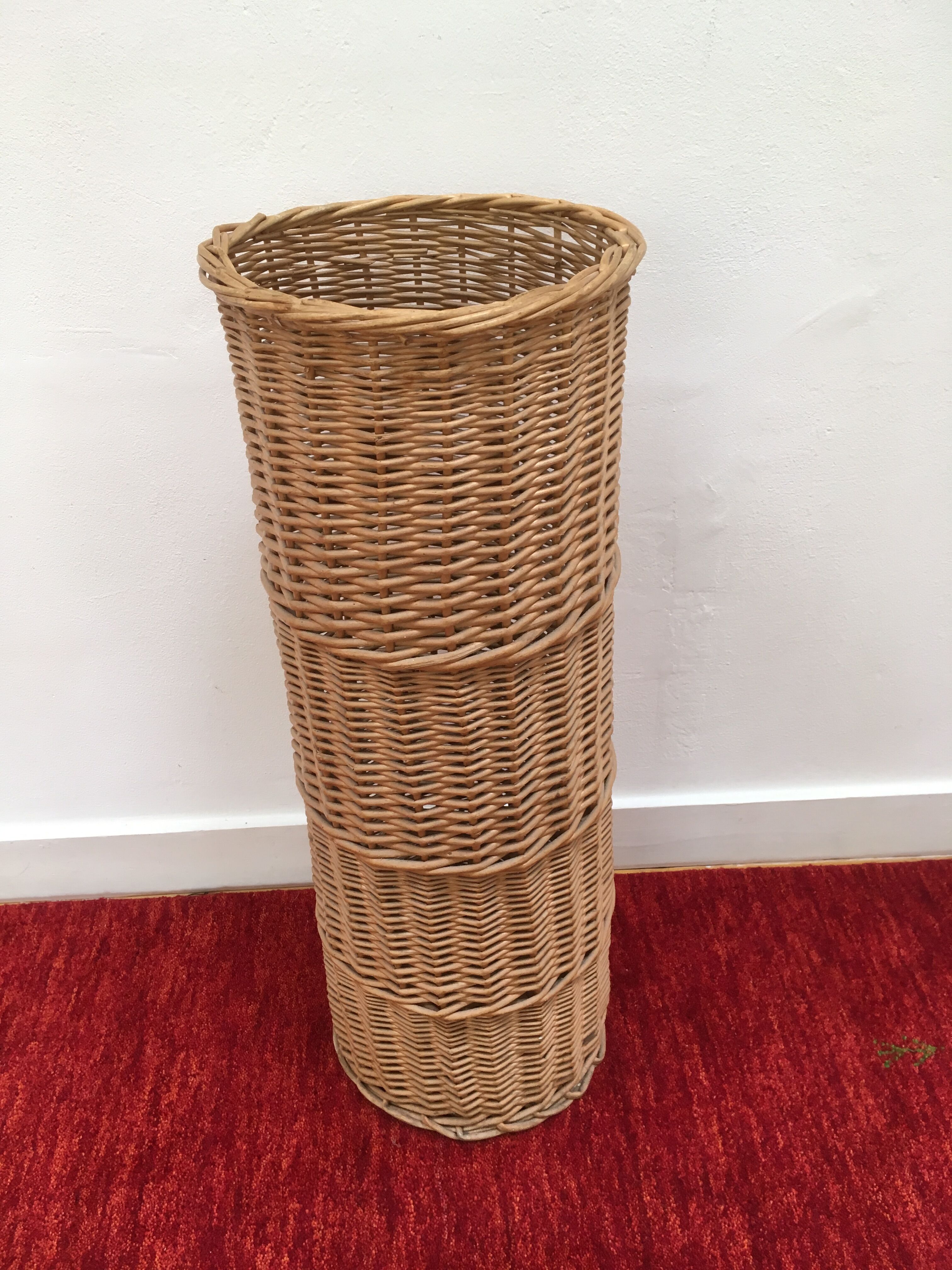 Vintage umbrella holder in wicker rattan