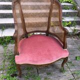Louis XV style walnut and cane armchair