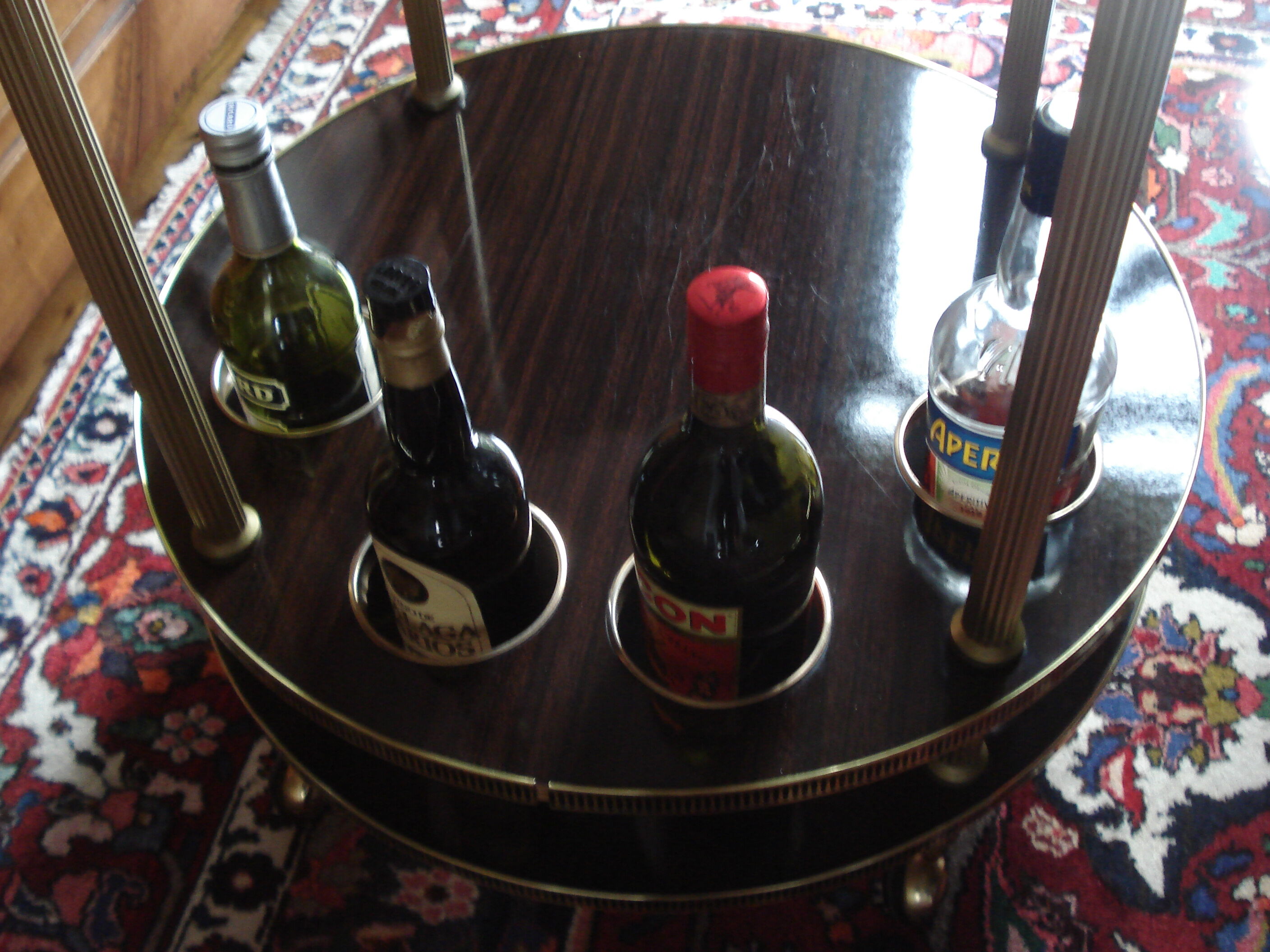 Round "bar" service in gilded metal on wheels and formica trays