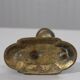 Handheld candlestick in bronze featuring a griffin, 19th-century Empire style.