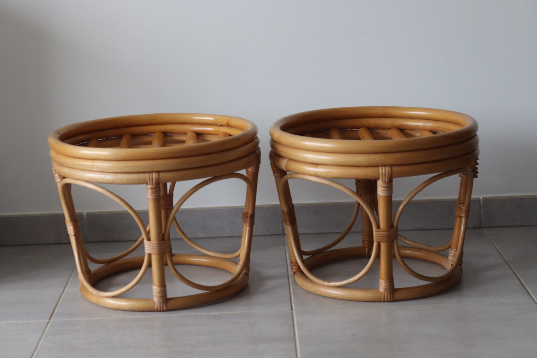Two vintage rattan ottomans