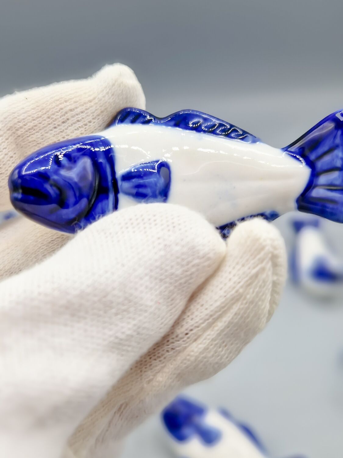 Set of 11 vintage blue and white porcelain fish knife rests.