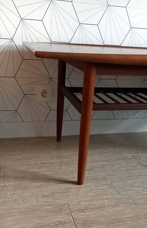 Danish 1960s teak coffee table with slatted shelf.