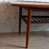 Danish 1960s teak coffee table with slatted shelf.