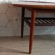 Danish 1960s teak coffee table with slatted shelf.