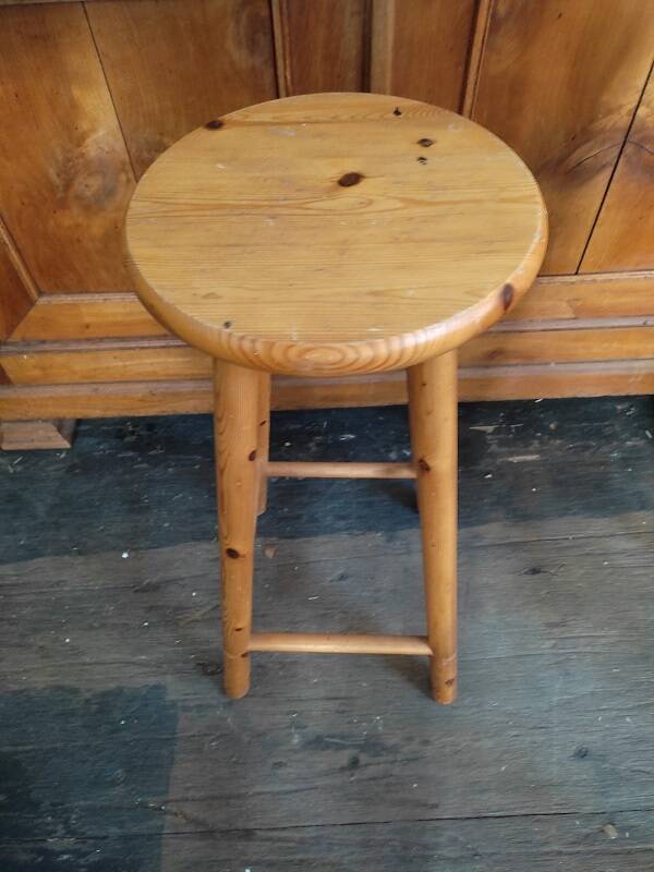 High bar stool in weathered wood round seat
