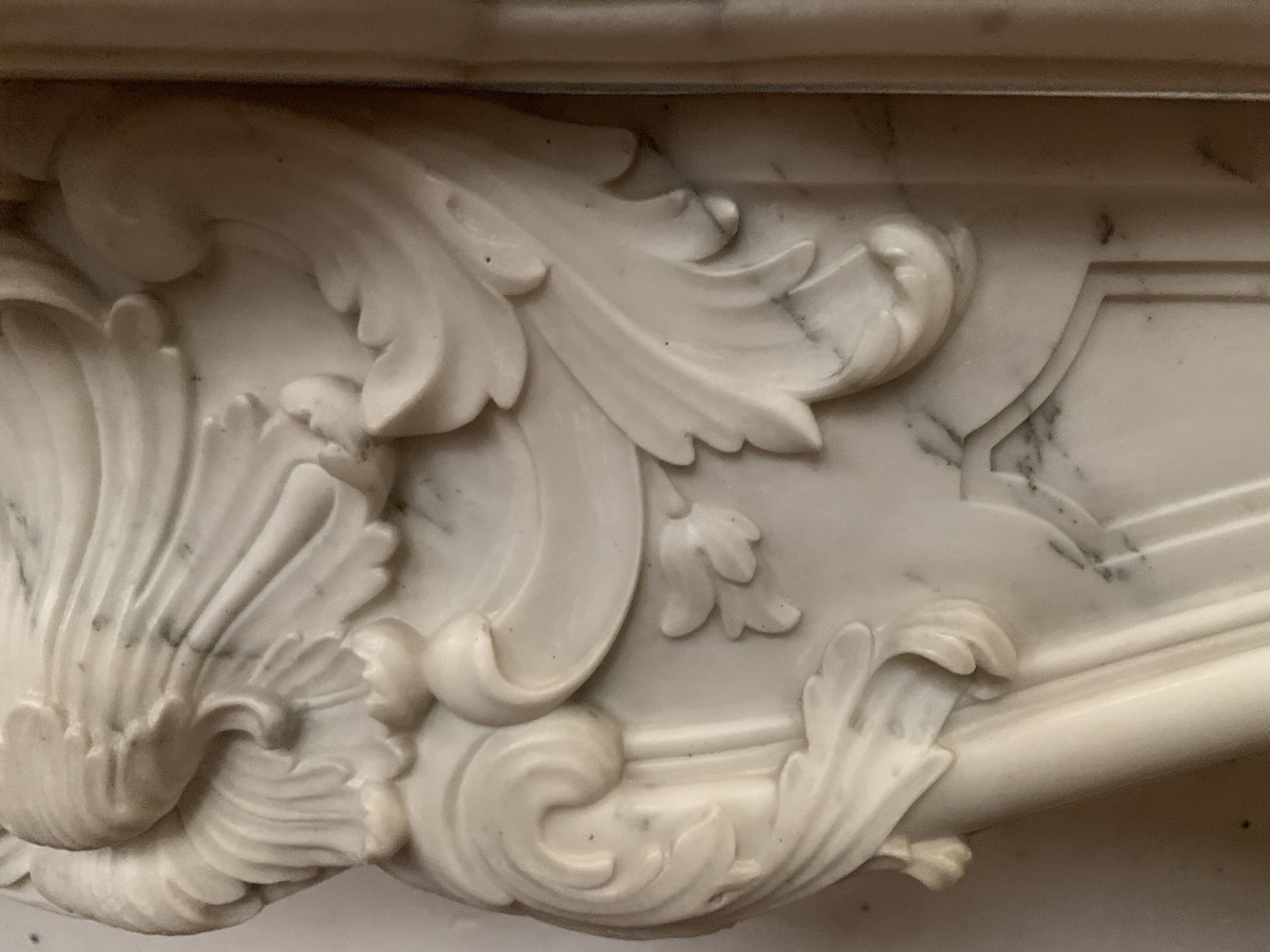 Louis XV style fireplace in white Carrara marble, 19th century