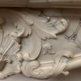 Louis XV style fireplace in white Carrara marble, 19th century