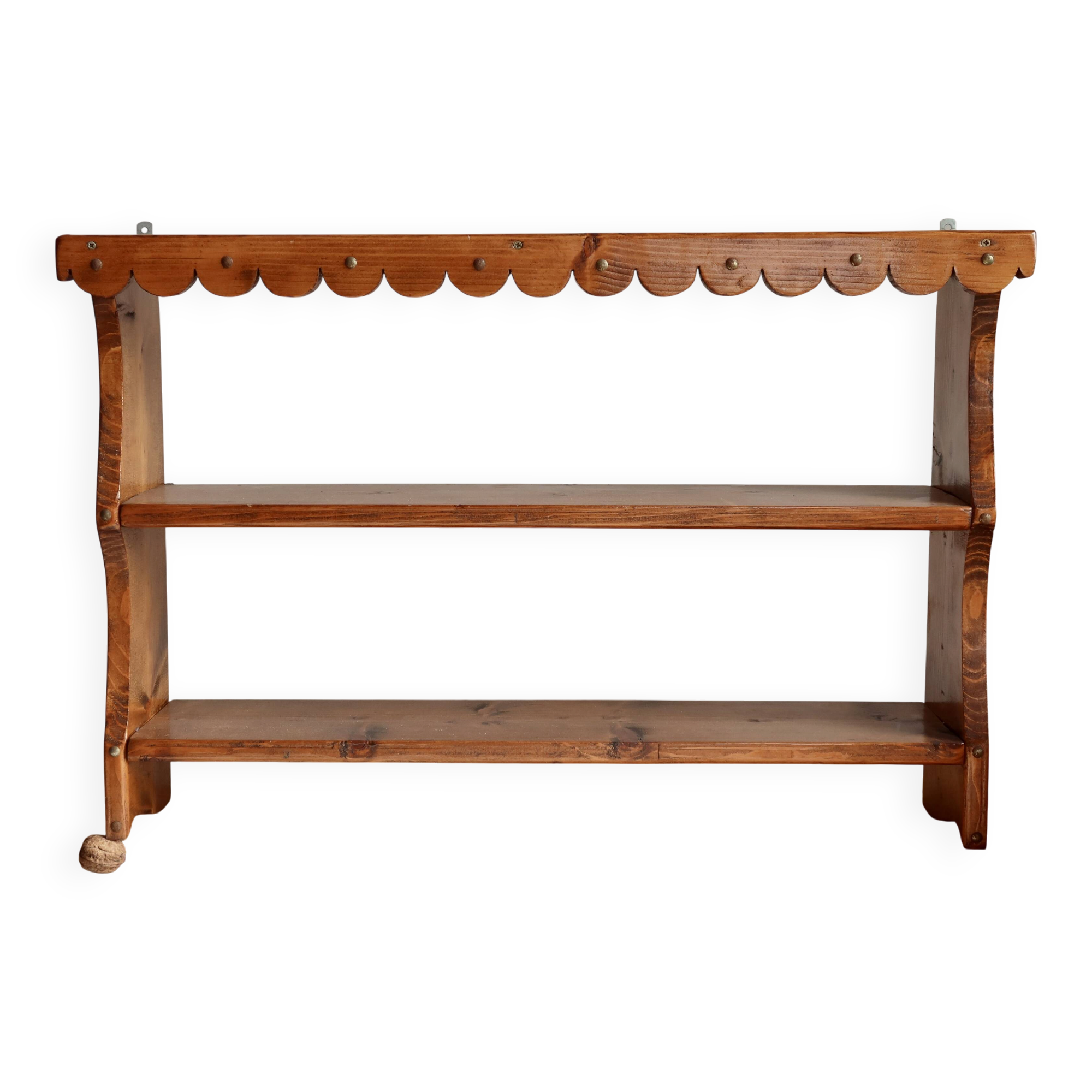 Vintage pine wall shelf with a scalloped front.