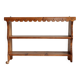 Vintage pine wall shelf with a scalloped front.
