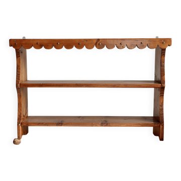 Vintage pine wall shelf with a scalloped front.