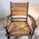 Armchair in oak and rush, brutalist style, designed by Charles Dudouyt, 1940s