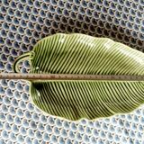 Slip dish in the shape of a palm leaf