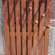 Wall-mounted coat rack in wood or wall hook.