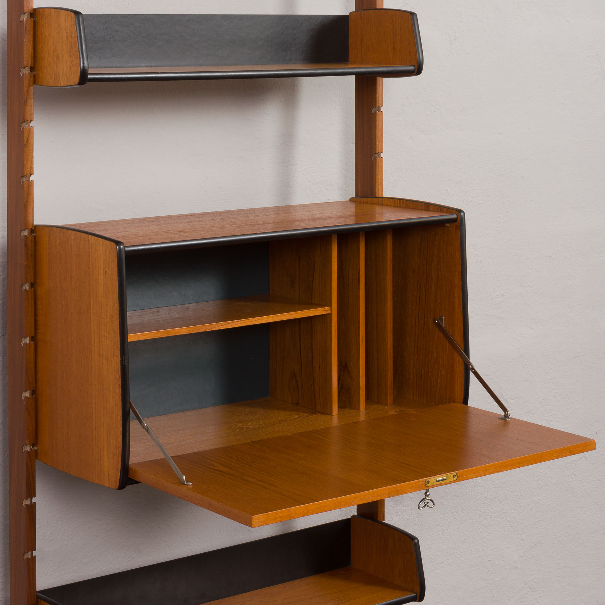 Scandinavian free standing vertical bookcase with a secrtetaire or home office wall unit model Ergo,