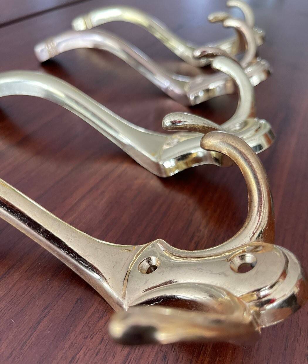 4 golden brass coat racks