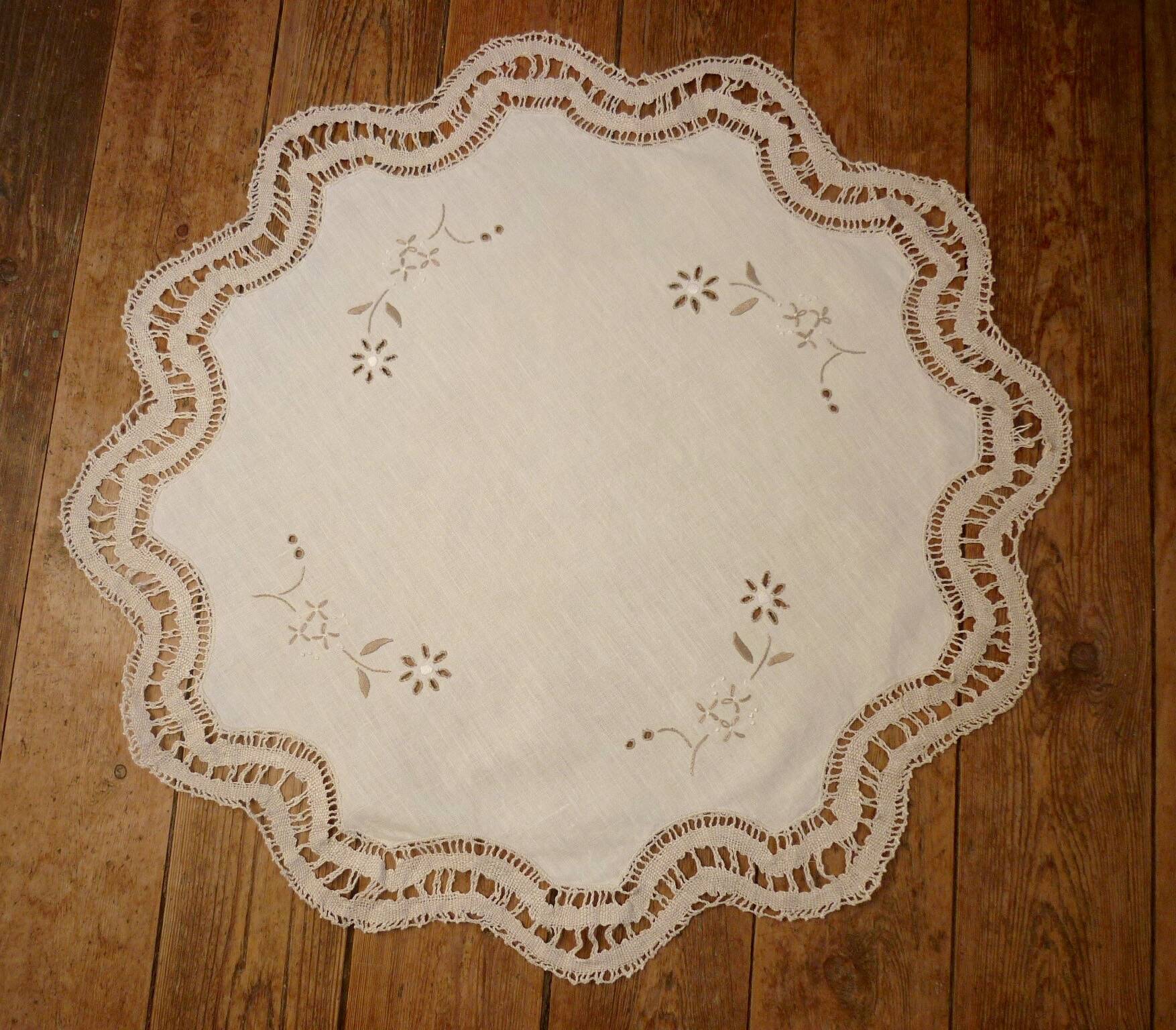Round embroidered and crocheted doily