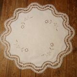 Round embroidered and crocheted doily