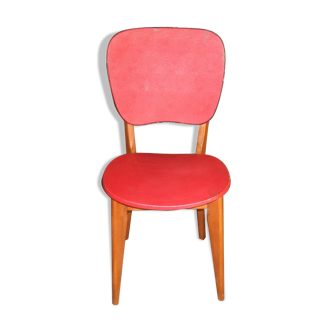 Wooden chair and red skai