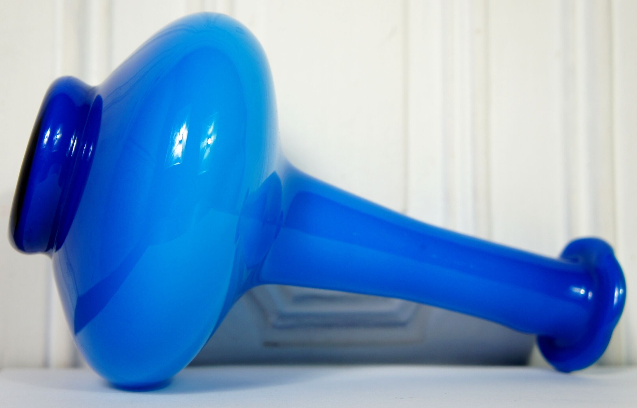 Flattened blown glass corolla vase