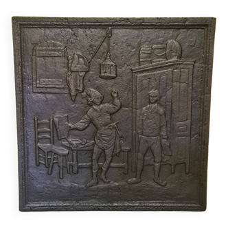 Plaque de cheminée française au décor du cordonnier et du banquier, fin du 19e siècle