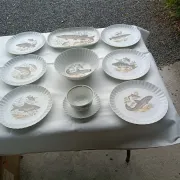 vintage porcelain dinner service with fish pattern and gold trim