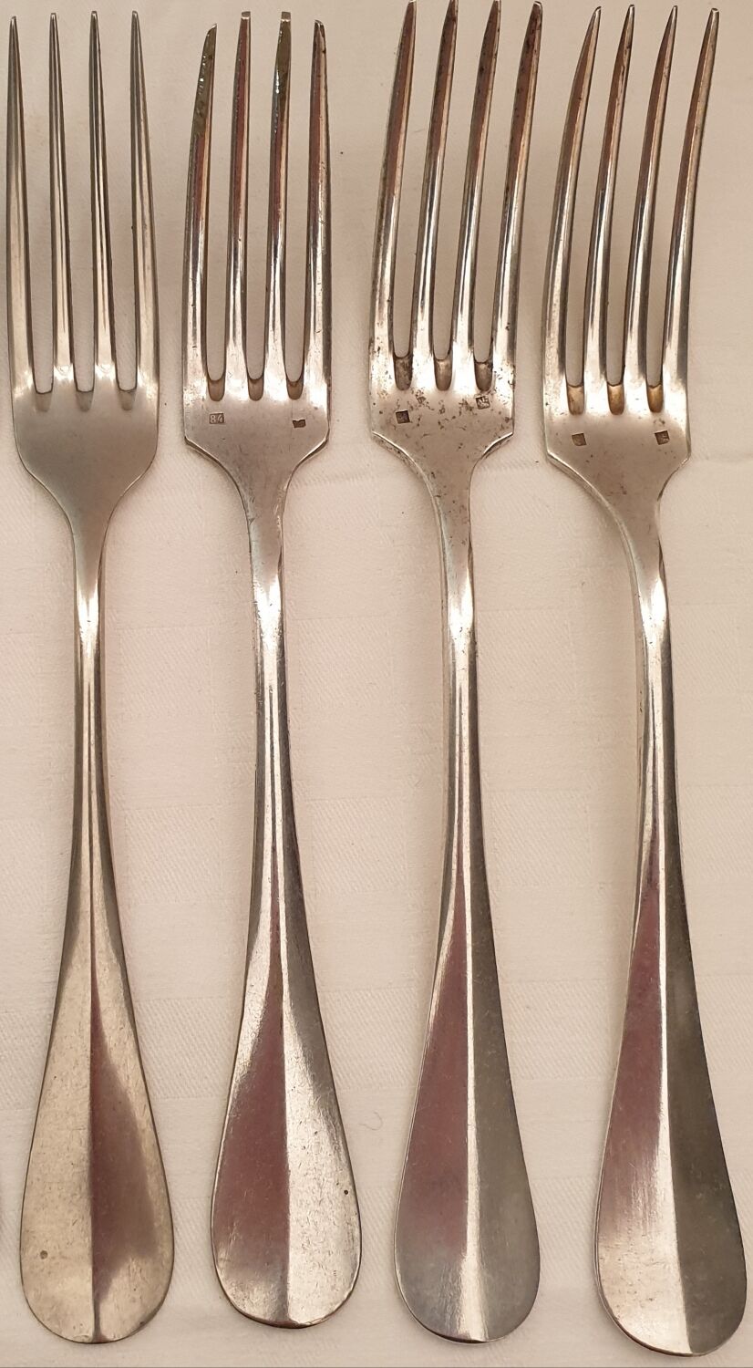 10 mismatched silver metal forks