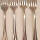 10 mismatched silver metal forks