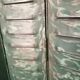 Lot of old green shutters in 4-part iron screen headboard