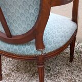 Paire de fauteuils médaillon style Louis XVI
