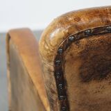 Fauteuil unique en cuir de mouton ancien