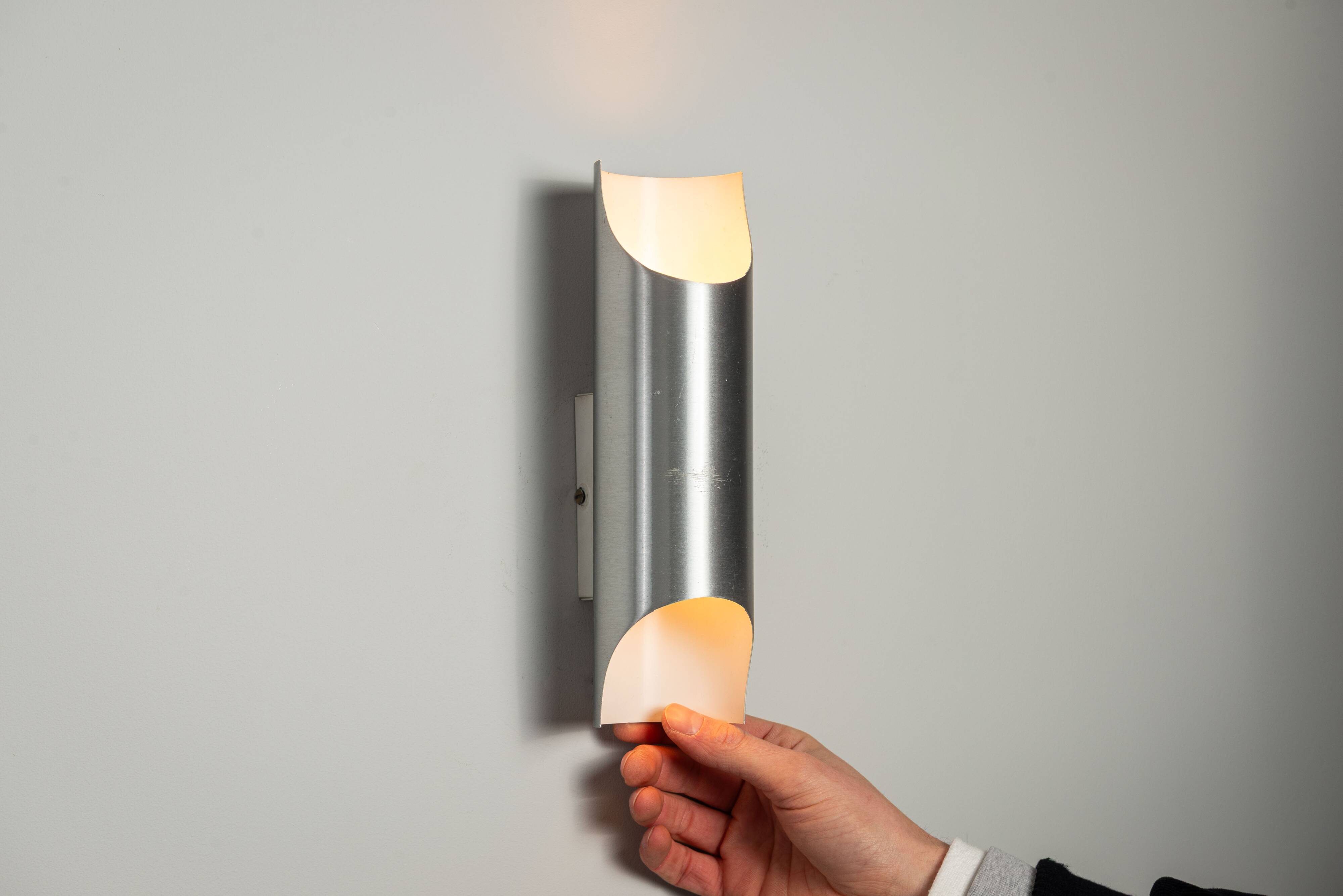 Set of three aluminium cylindrical wall lamps