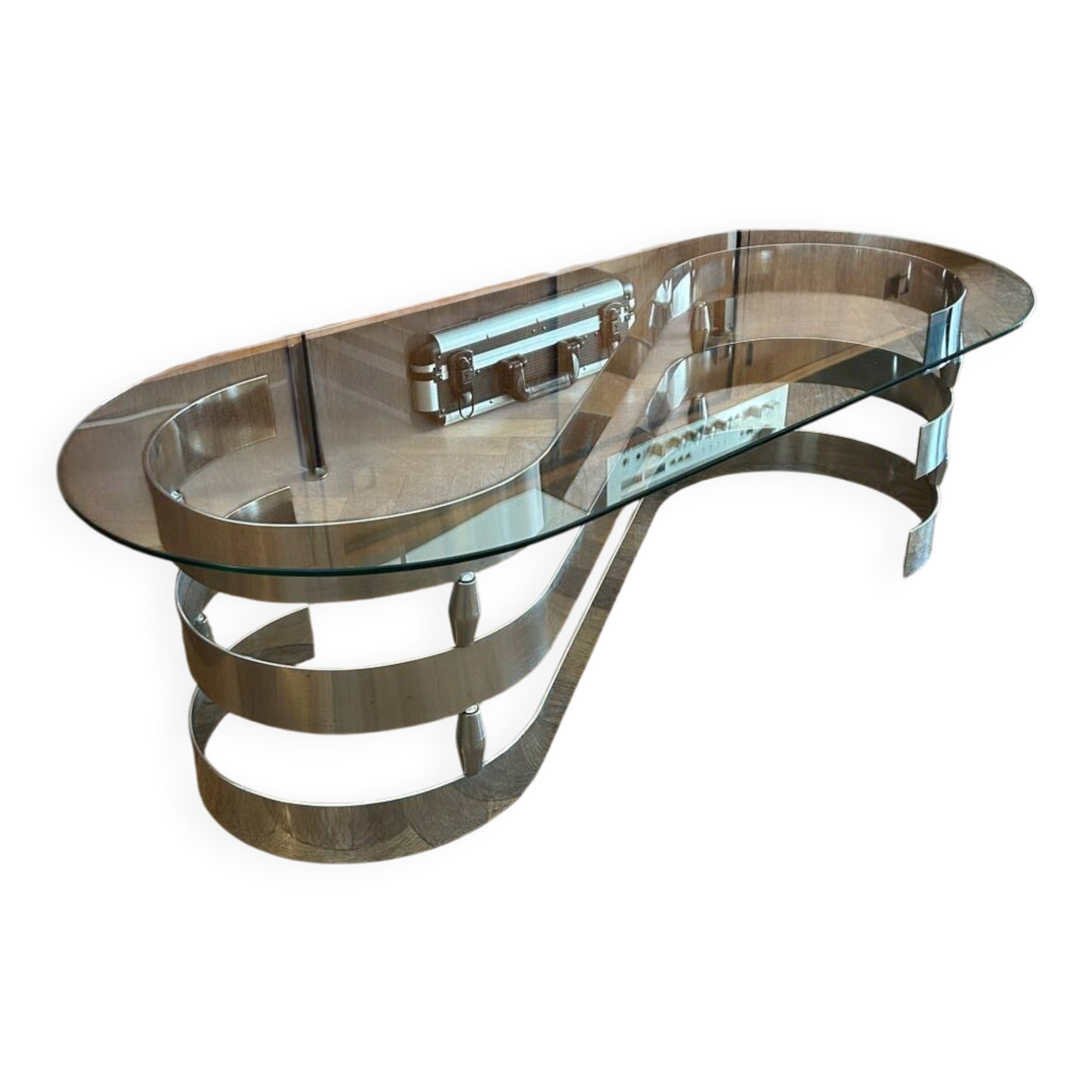 70s design oval coffee table in glass with chrome legs.