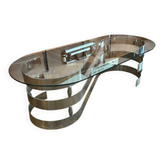 70s design oval coffee table in glass with chrome legs.