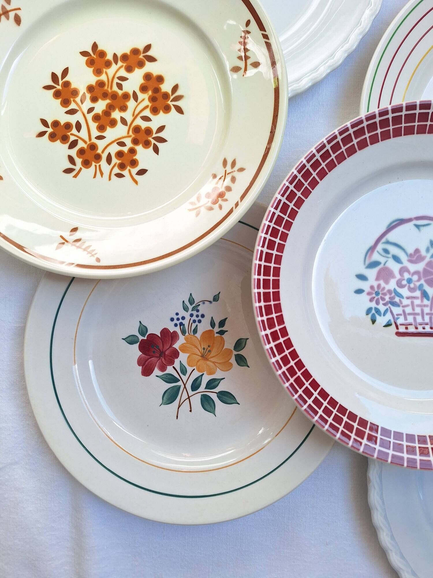 Multicolored flower dinner plates from Moulin des Loups, St Amand and Badonville