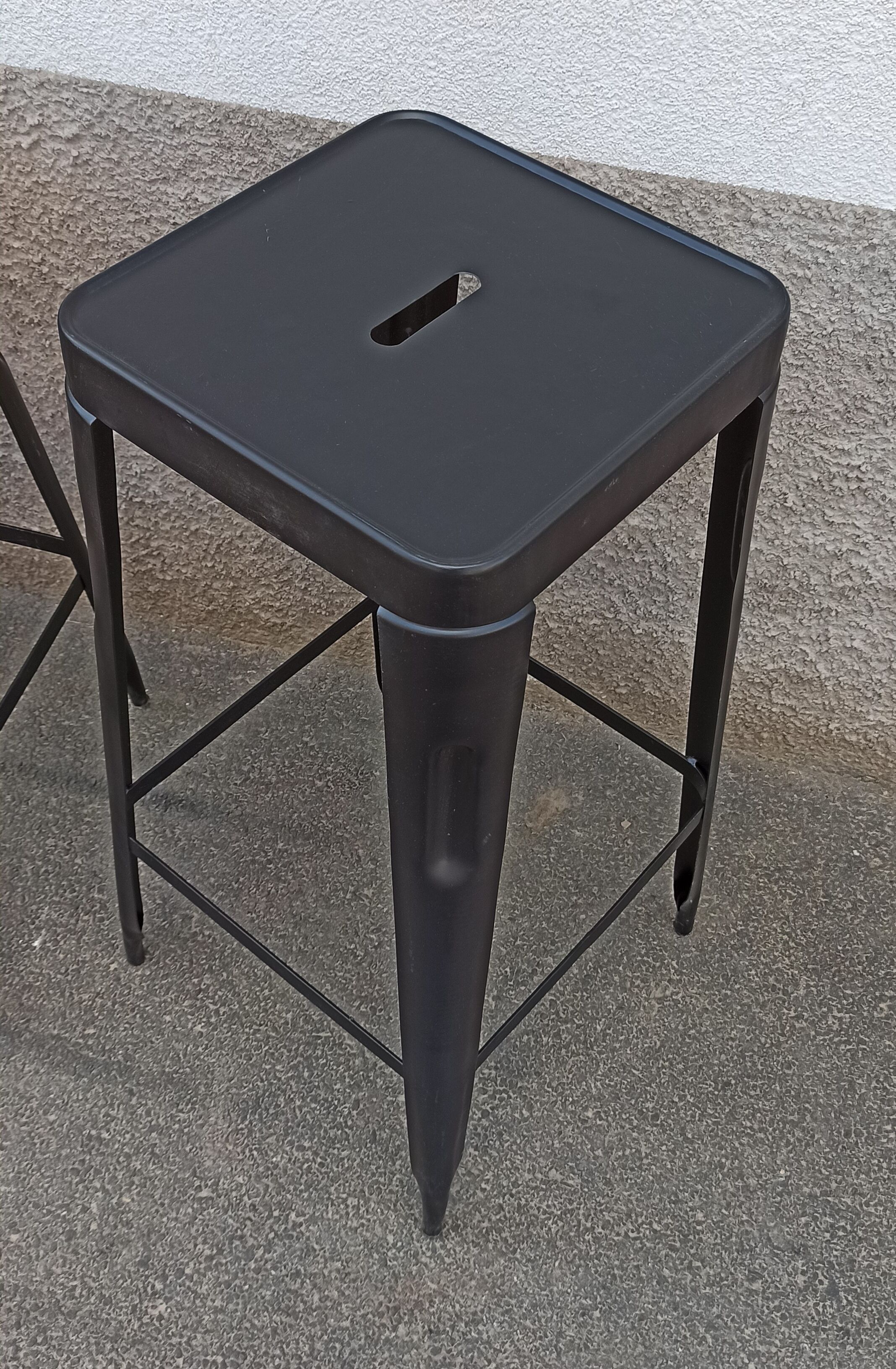 Pair of black metal stools